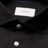black solid short sleeve linen shirt 2025 04 22T082049482Z.webp