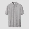 light grey horisontal striped fine knit polo shirt 2024 09 23T06455039Z.webp